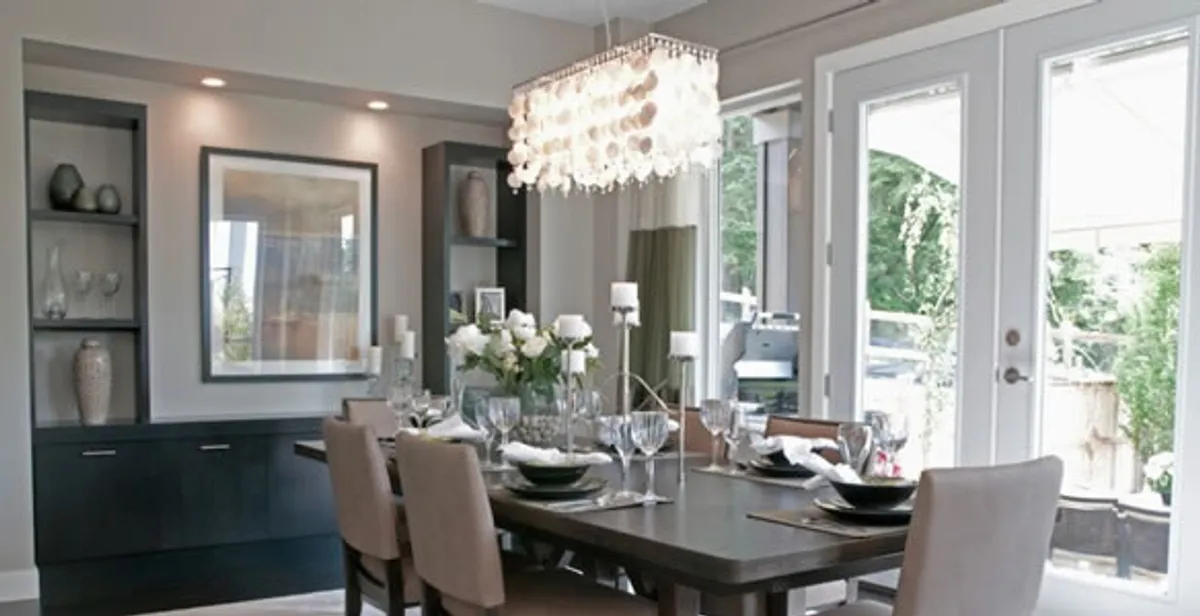 Elegant dining room chandelier installation above table in Easton, PA
