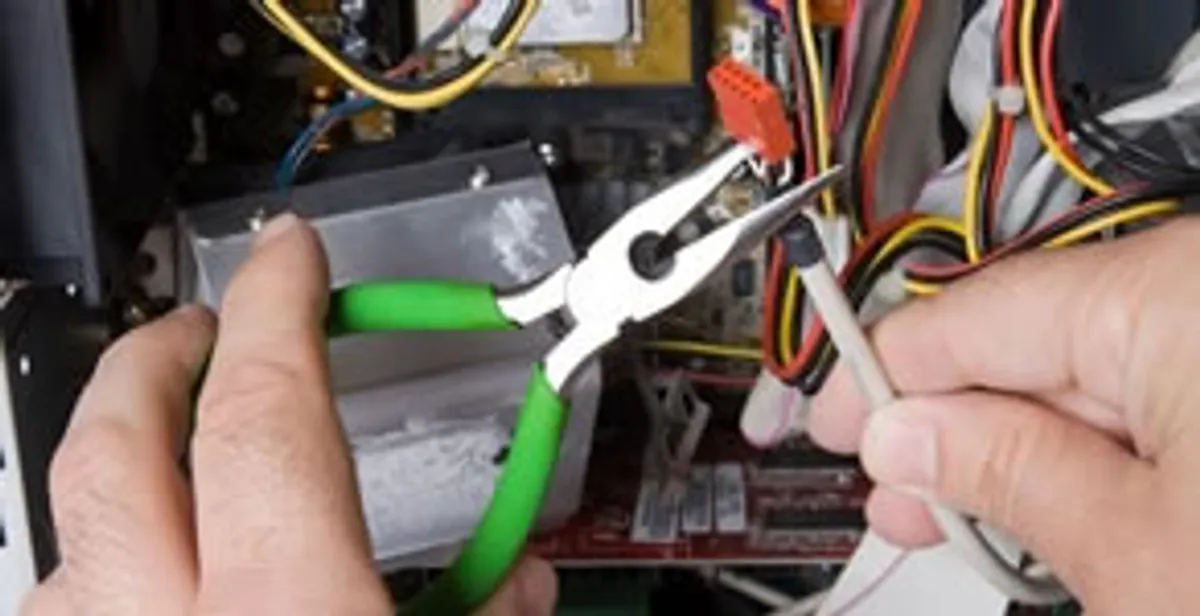 Licensed electrical contractor performing electrical repair with tools in Bloomsbury, NJ